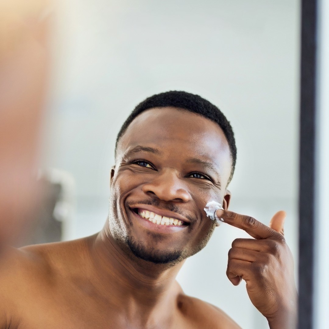 men applying cream on face